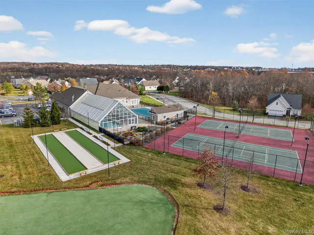 a view of yard with swimming pool and ocean view