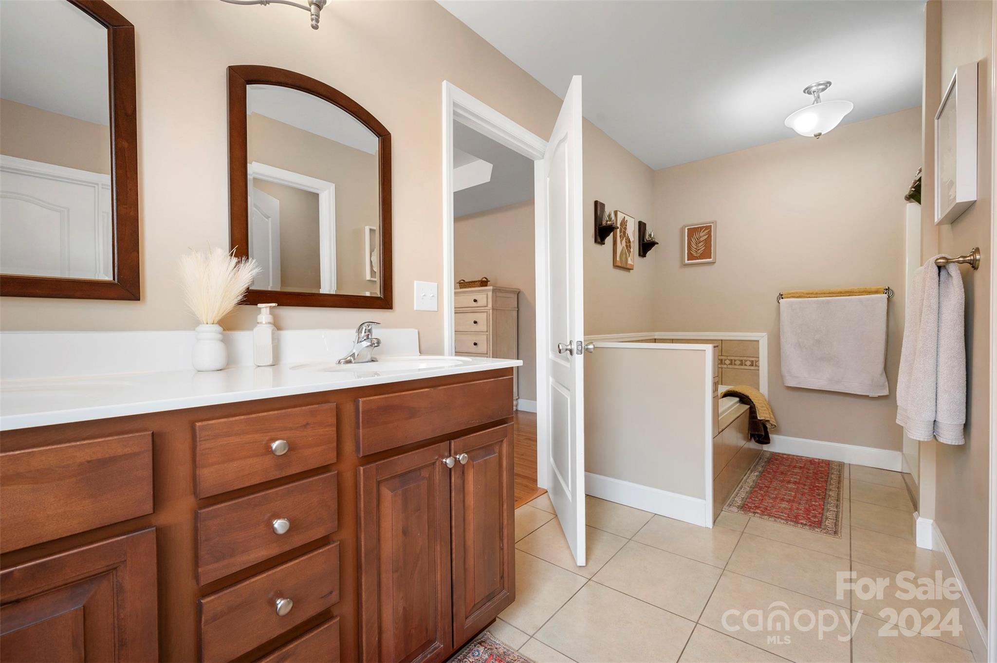 210 Thompson Road Rutherfordton, NC 28139 - Photo 17 of 44 a spacious bathroom with a double vanity sink and a mirror