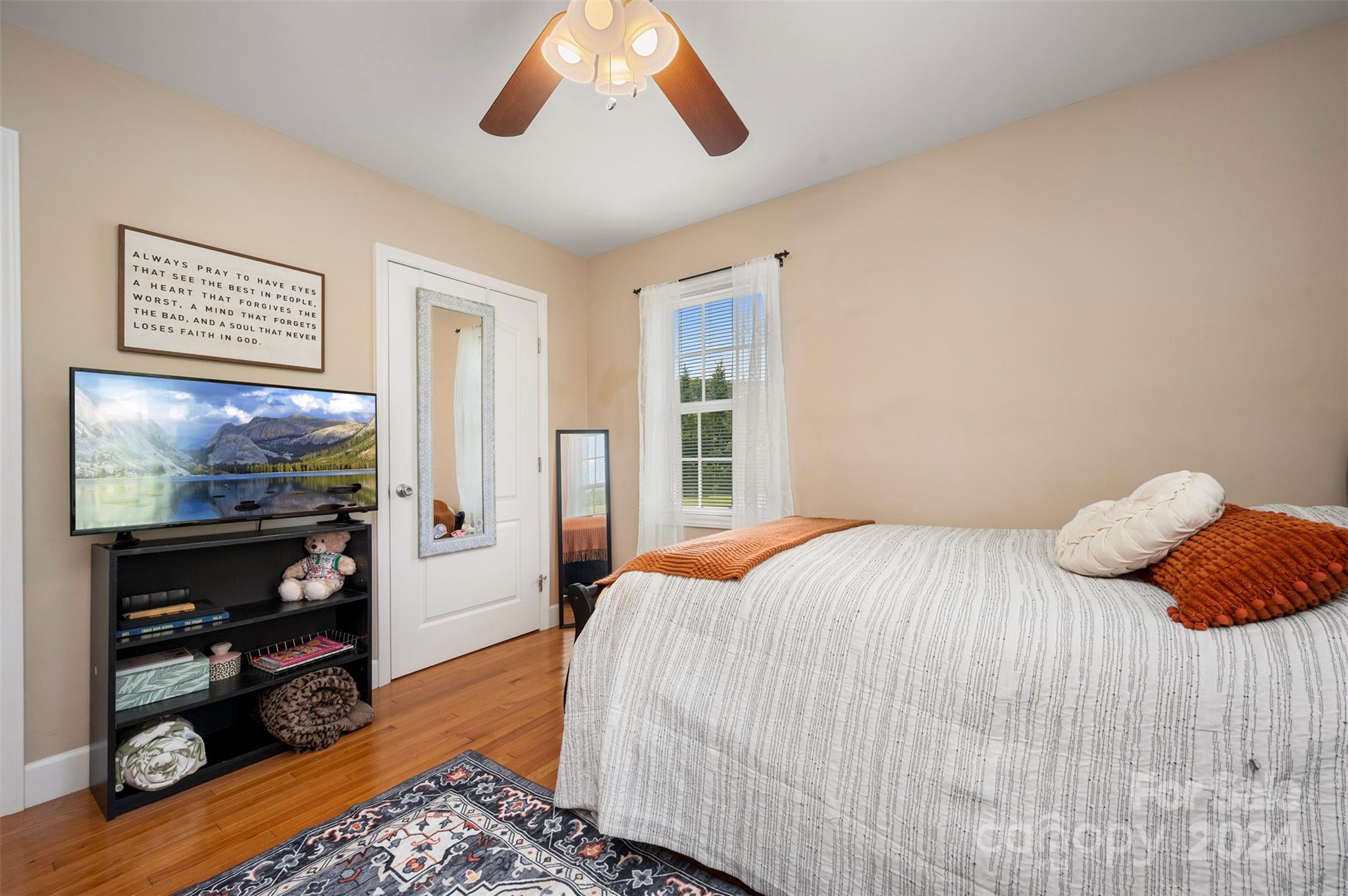 210 Thompson Road Rutherfordton, NC 28139 - Photo 24 of 44 a bedroom with a bed and a flat screen tv