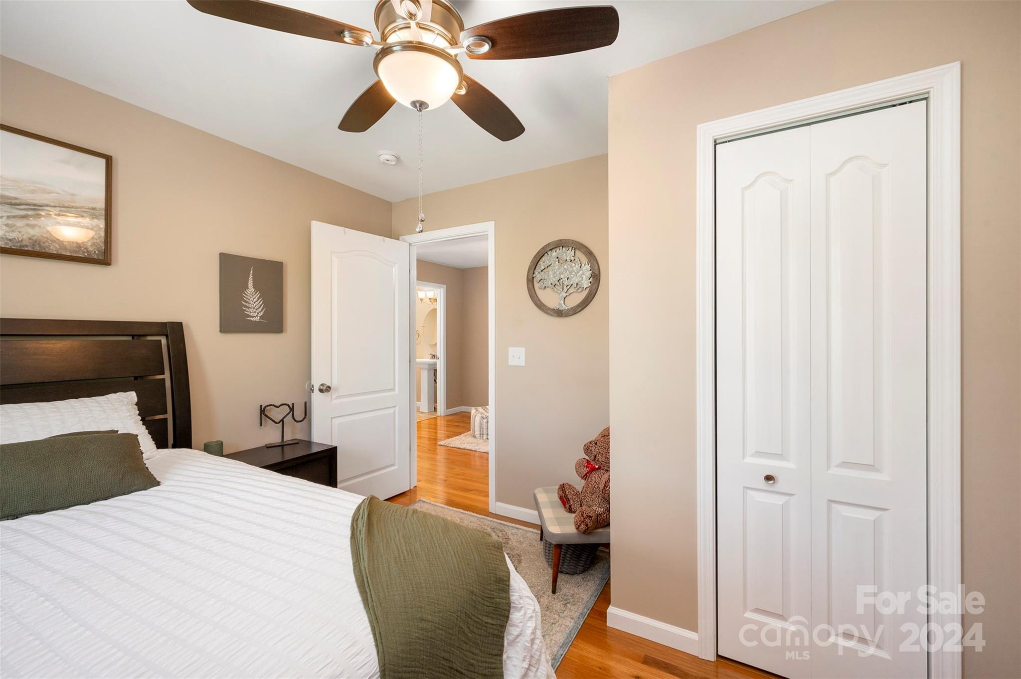 210 Thompson Road Rutherfordton, NC 28139 - Photo 25 of 44 a bedroom with a bed and a chandelier