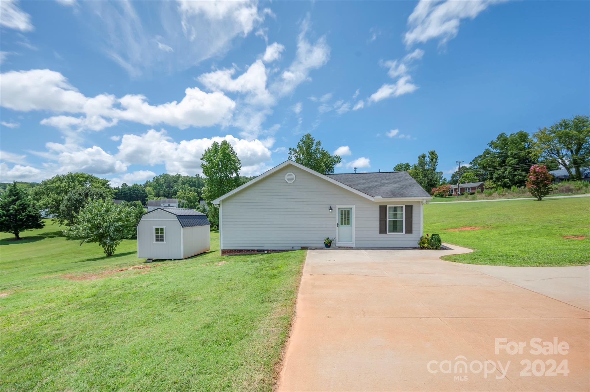 210 Thompson Road Rutherfordton, NC 28139 - Photo 43 of 44 a front view of a house with a yard and garage