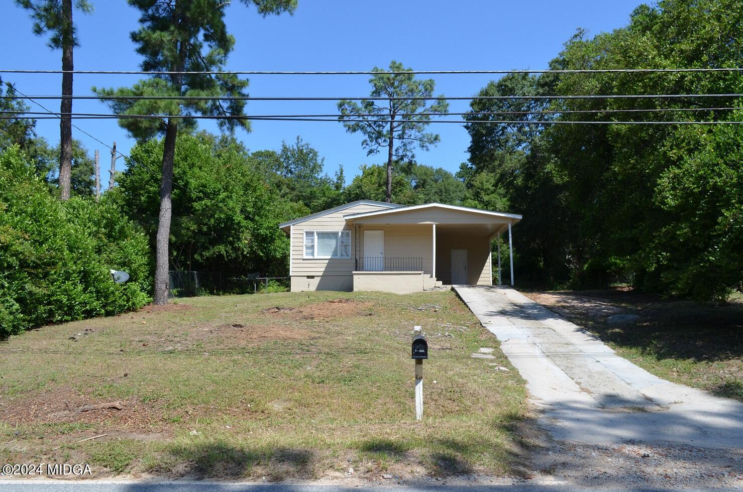 1579 Canterbury Road Macon, GA 31206 - Photo 15 of 15 a view of a yard and front view of a house