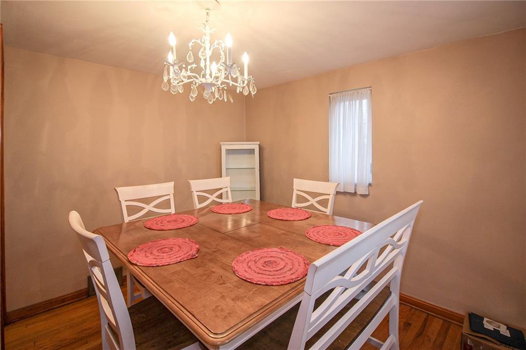 164 Gill Hall Road Clairton, PA 15025 - Photo 10 of 30 a view of a dining room with furniture and chandelier