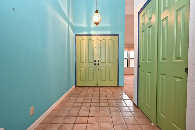 a view of a hallway with a flower pot