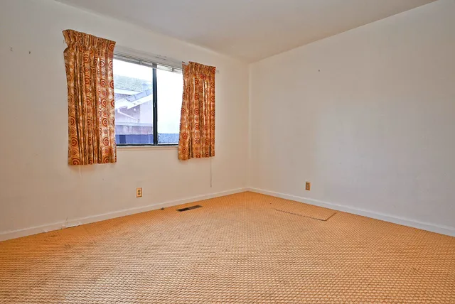 an empty room with a window