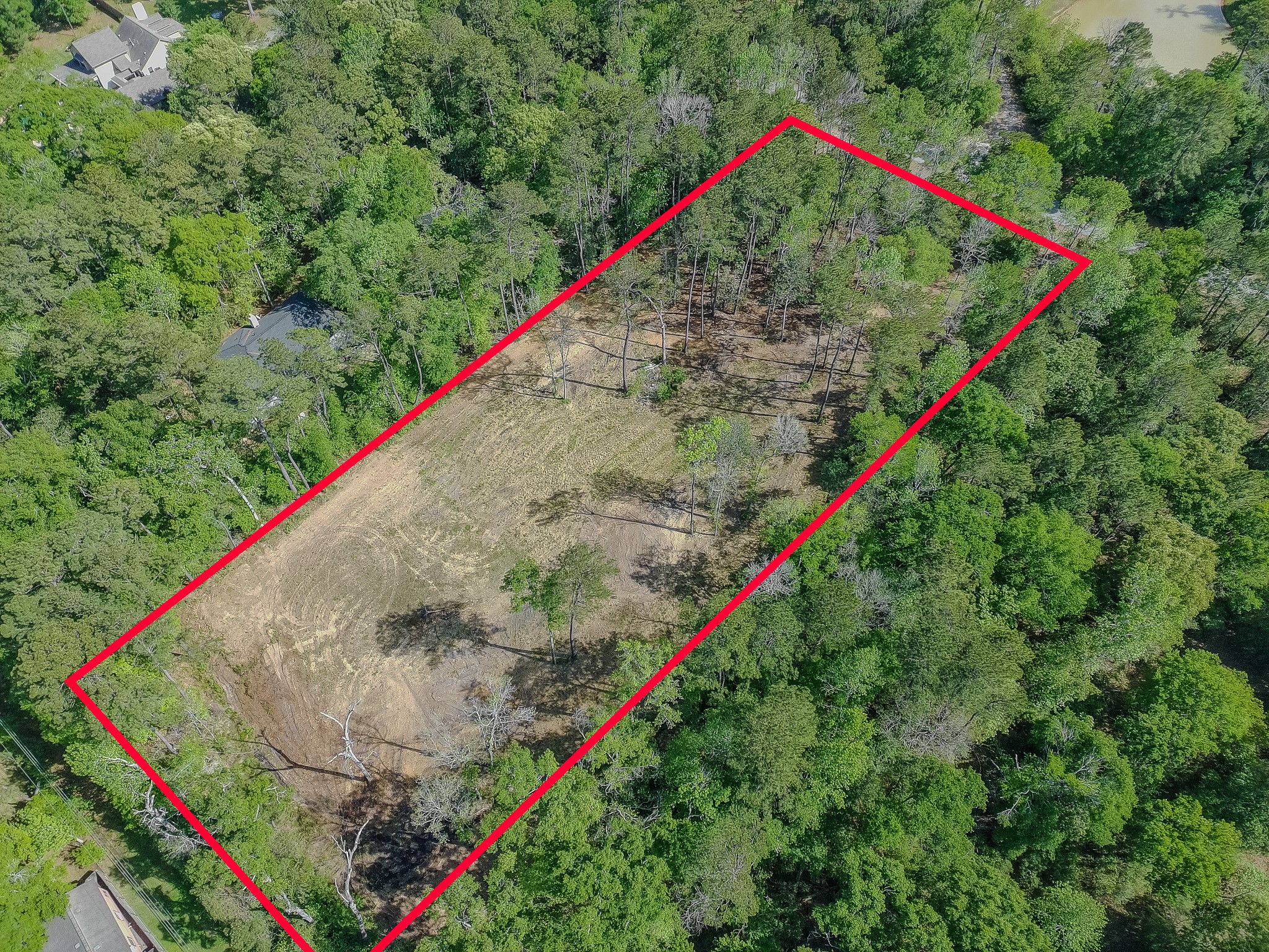 0 Ascot Farms Road Magnolia, TX 77354 - Photo 11 of 12 View from the back, left corner of the site. This view shows the approx 100'x100' pad towards the back right corner of the property.