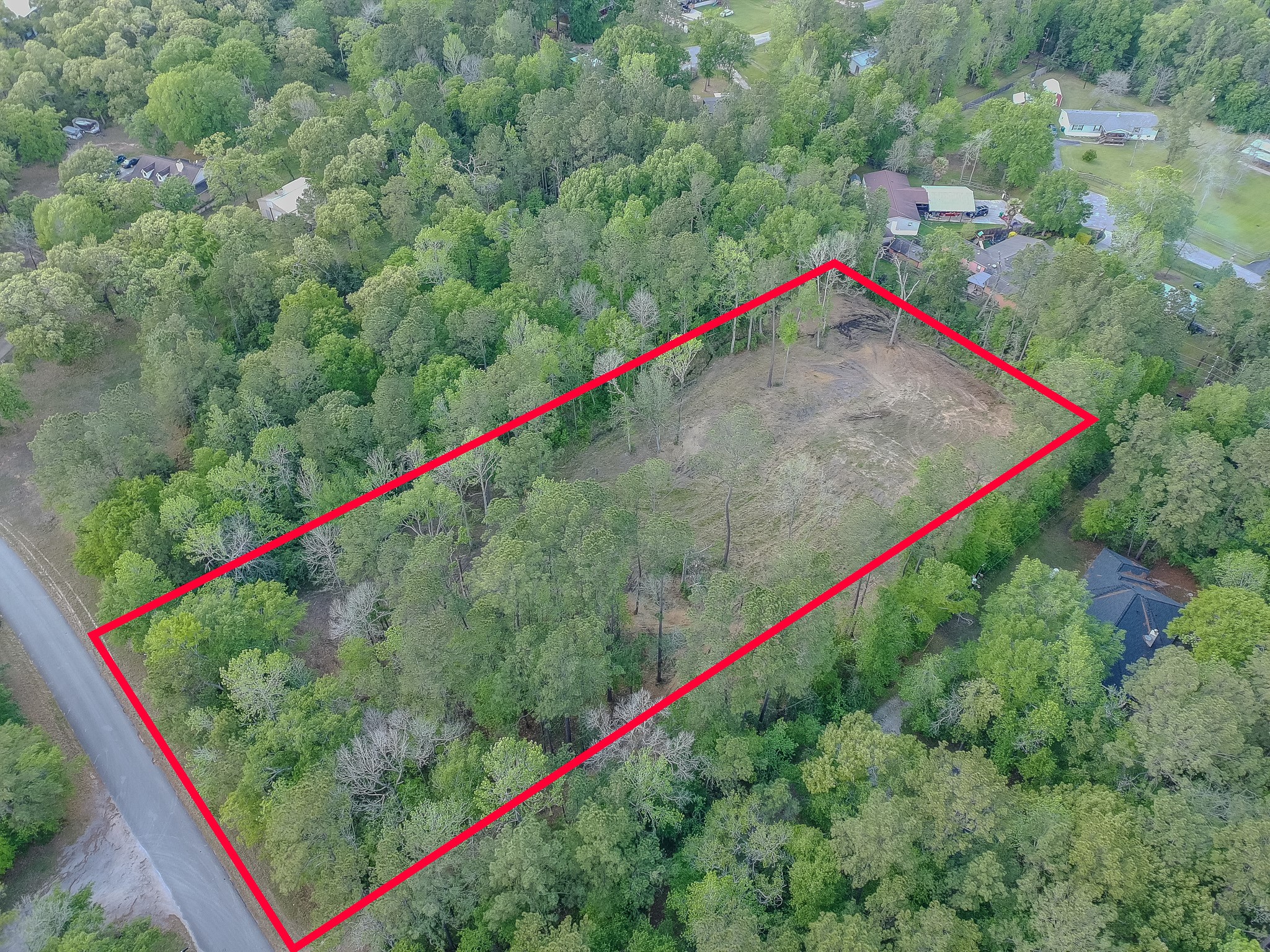 0 Ascot Farms Road Magnolia, TX 77354 - Photo 7 of 12 Over 200 loads of select fill has been brought in for a pad, preparing for an 80'x100' building at the back right corner of the property.