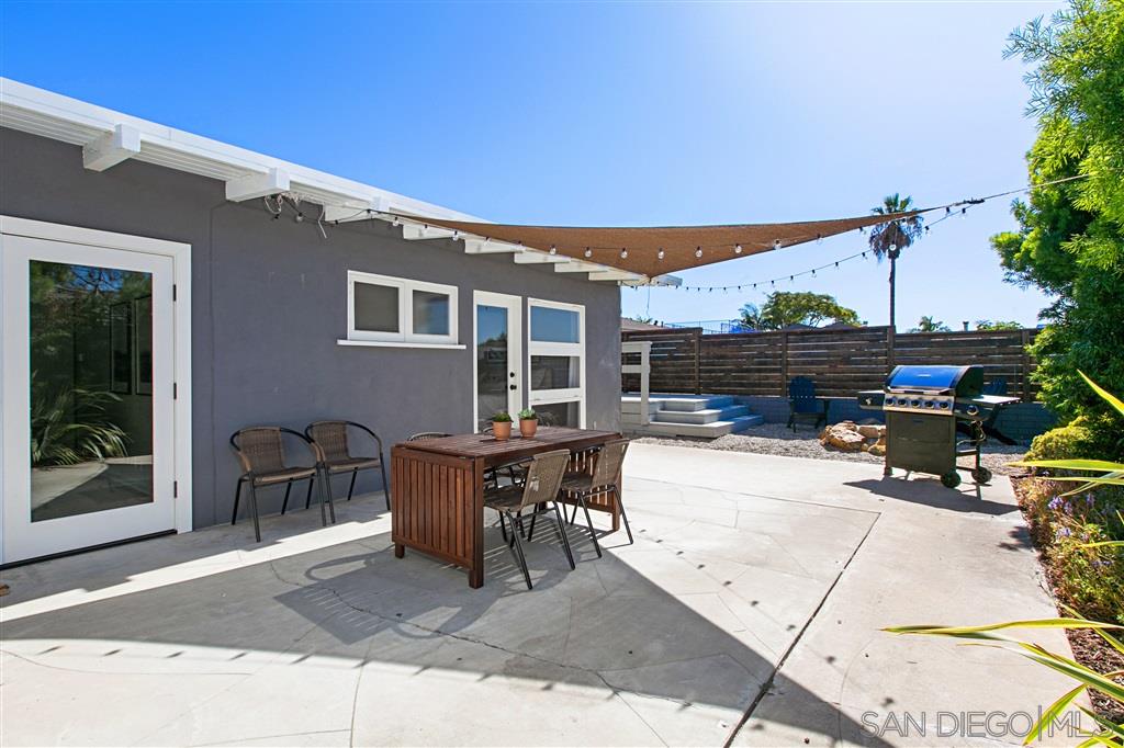 759 Bellevue Place La Jolla, CA 92037 - Photo 13 of 15 a view of a patio with table and chairs and potted plants