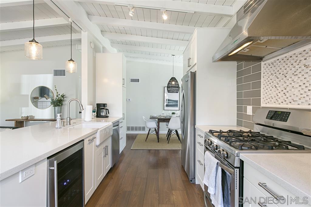 759 Bellevue Place La Jolla, CA 92037 - Photo 4 of 15 a kitchen with a sink stove and cabinets