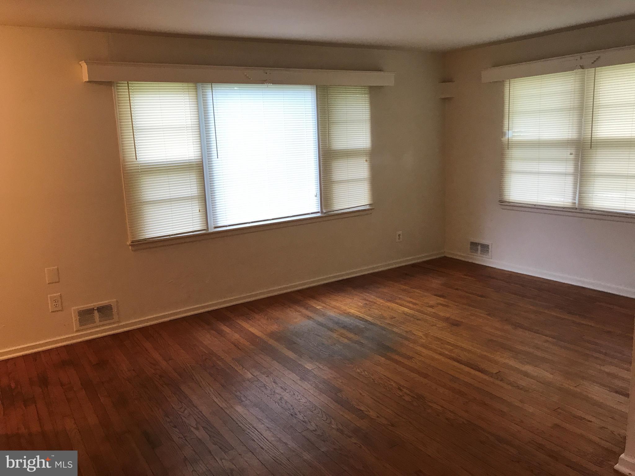 3325 Clay Street Silver Spring, MD 20902 - Photo 3 of 7 an empty room with wooden floor and windows