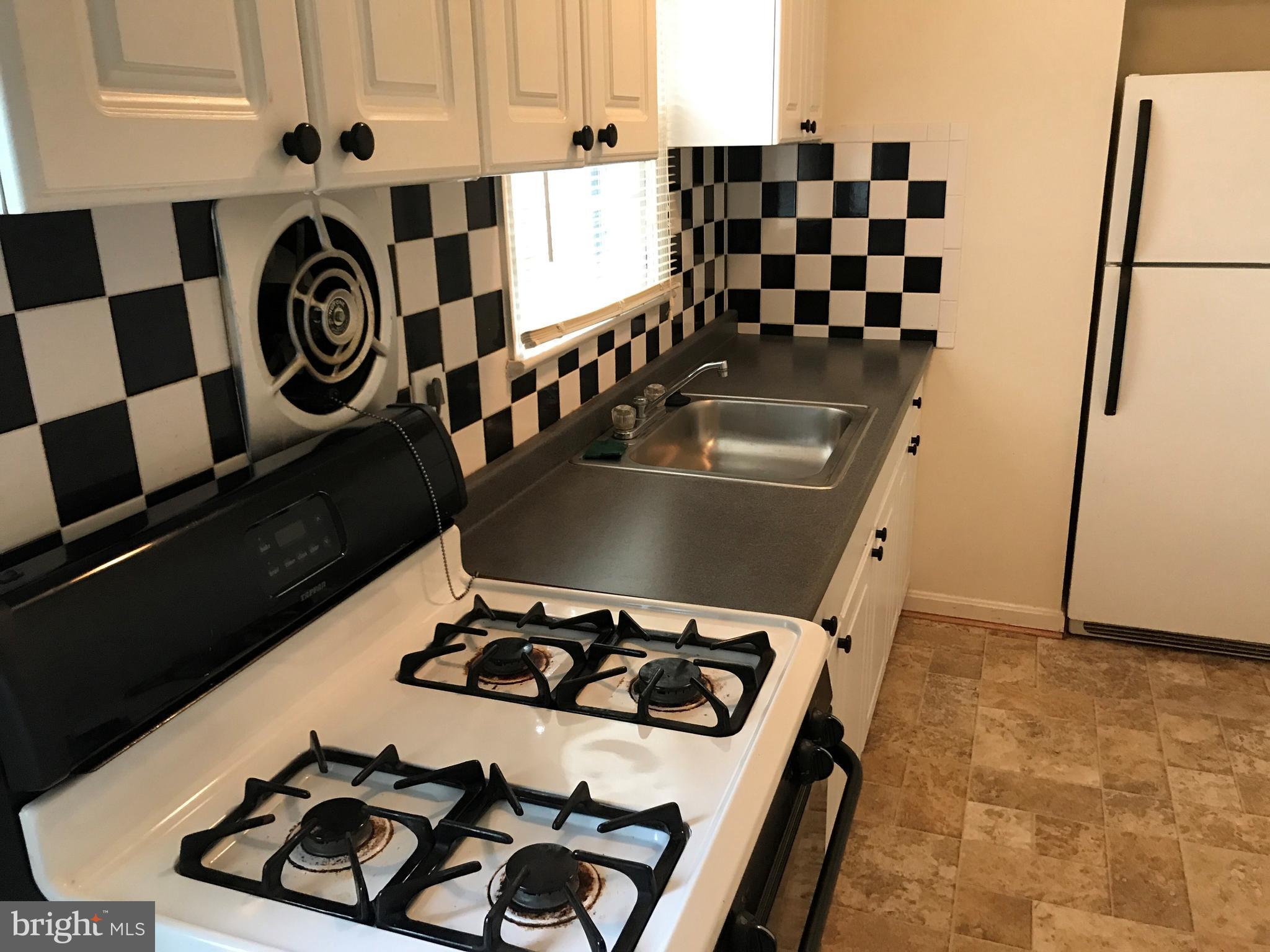 3325 Clay Street Silver Spring, MD 20902 - Photo 4 of 7 a kitchen with a sink and a stove