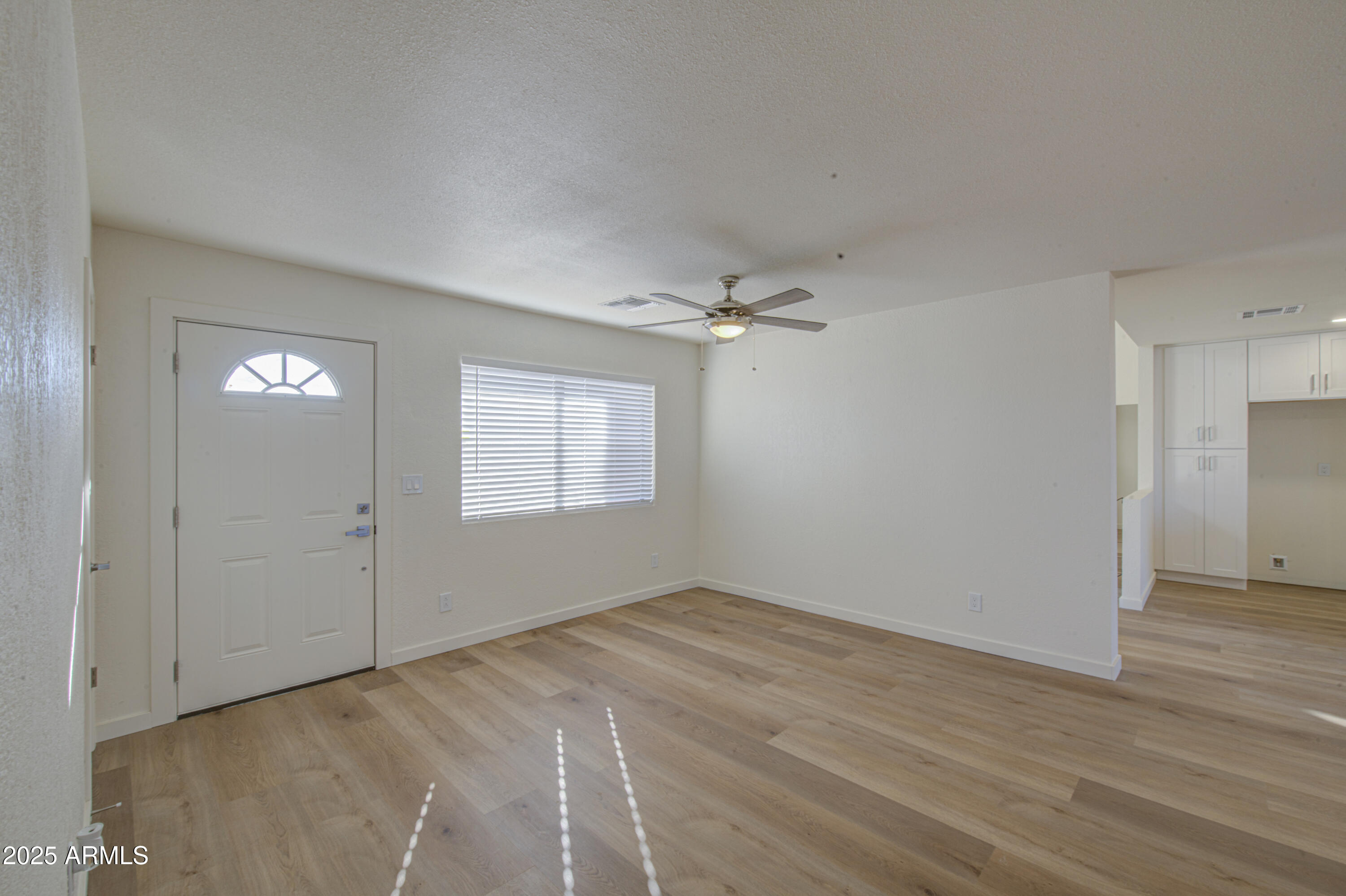 25450 West Clayton Road Casa Grande, AZ 85193 - Photo 12 of 80 wooden floor in an empty room with a window