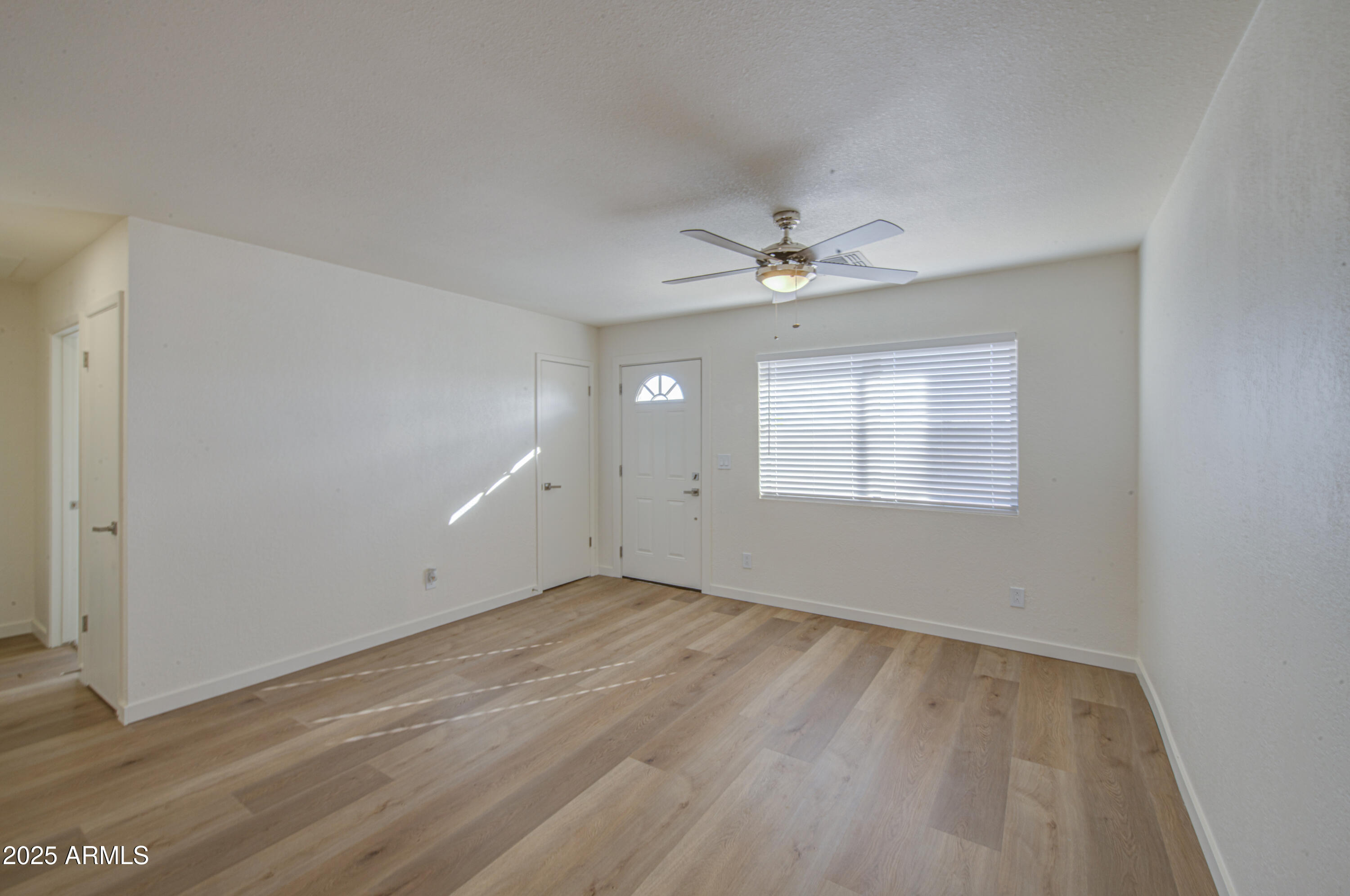 25450 West Clayton Road Casa Grande, AZ 85193 - Photo 15 of 80 wooden floor in an empty room with a window
