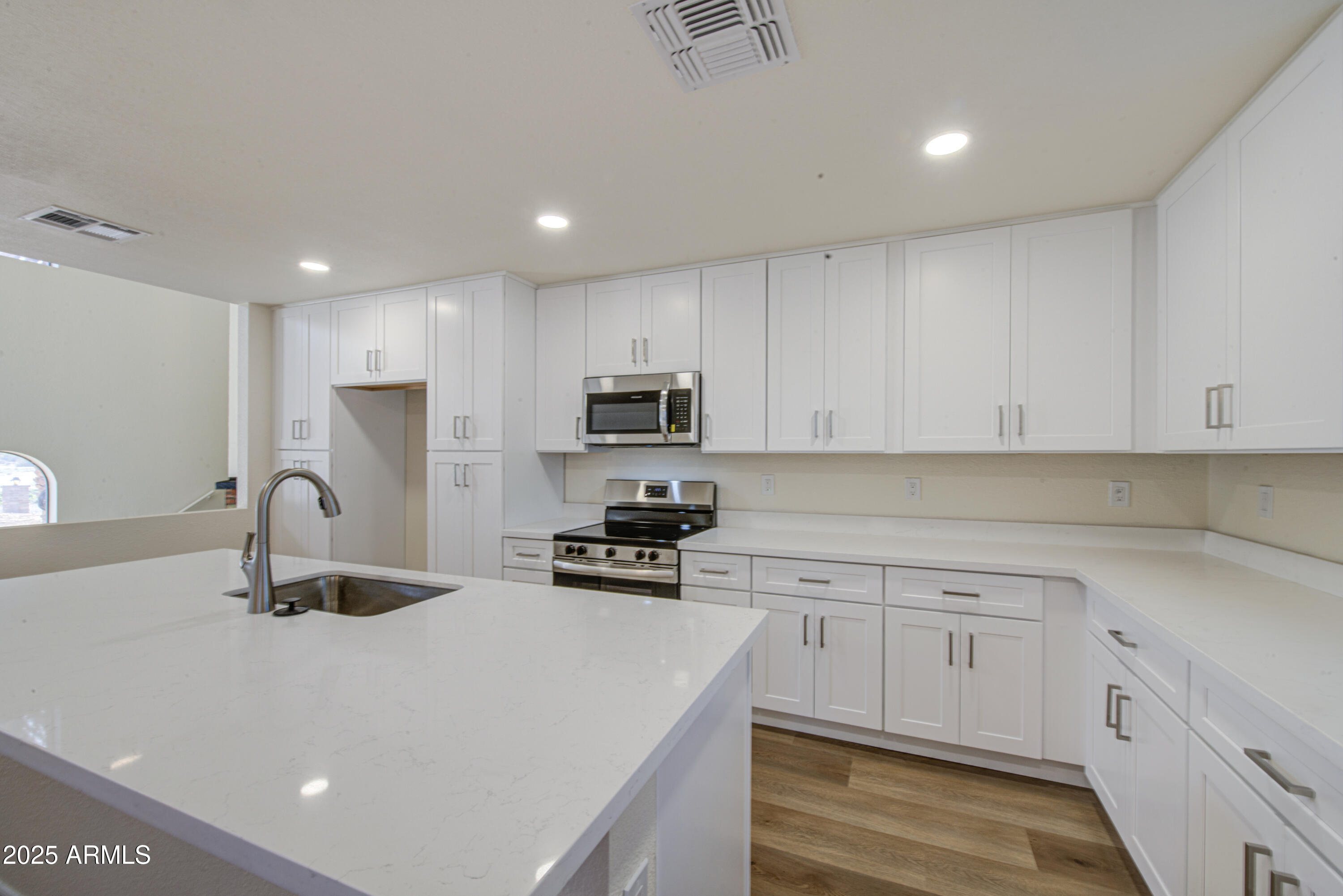 25450 West Clayton Road Casa Grande, AZ 85193 - Photo 22 of 80 a kitchen with kitchen island a sink stainless steel appliances and cabinets