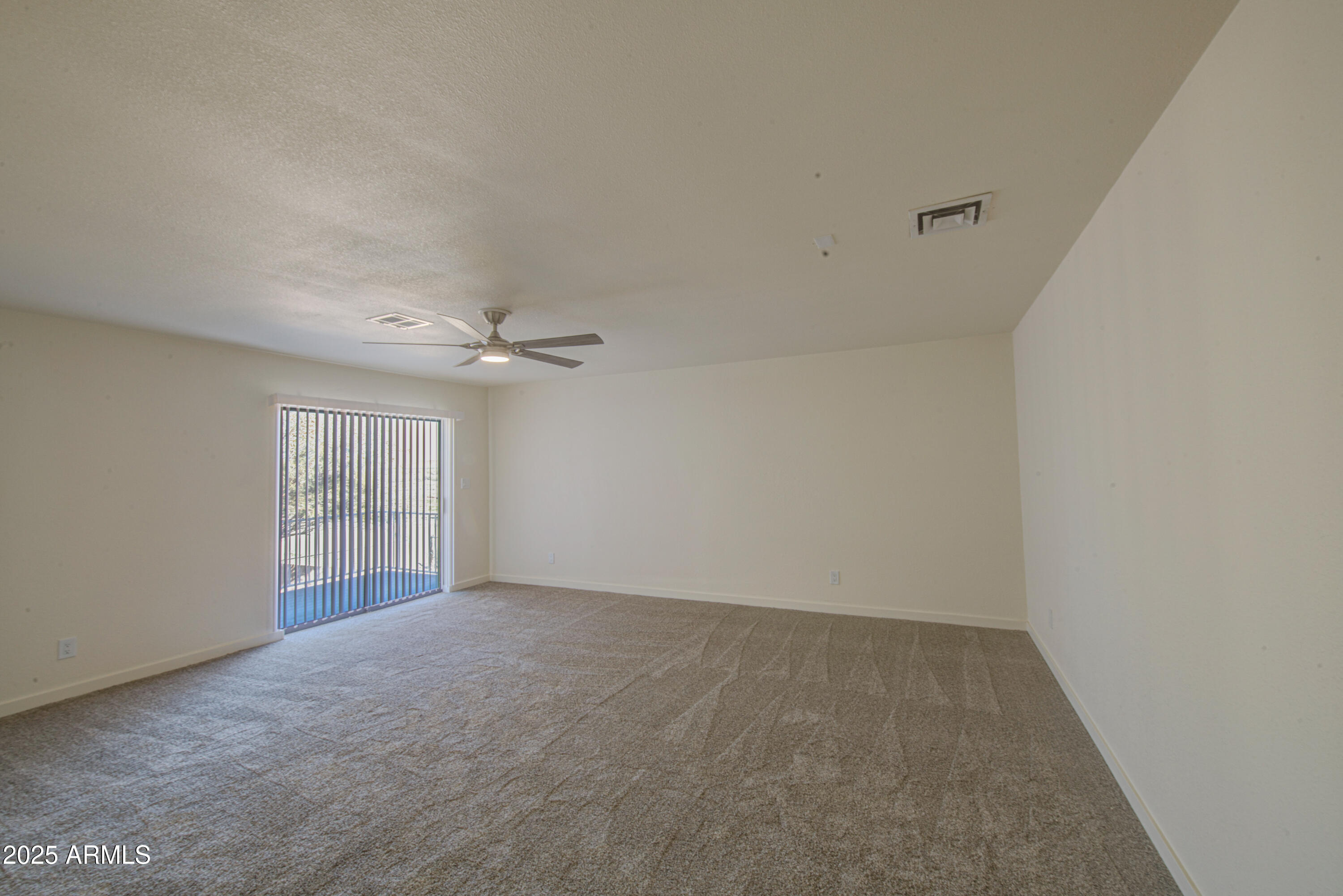 25450 West Clayton Road Casa Grande, AZ 85193 - Photo 23 of 80 an empty room with windows and fan