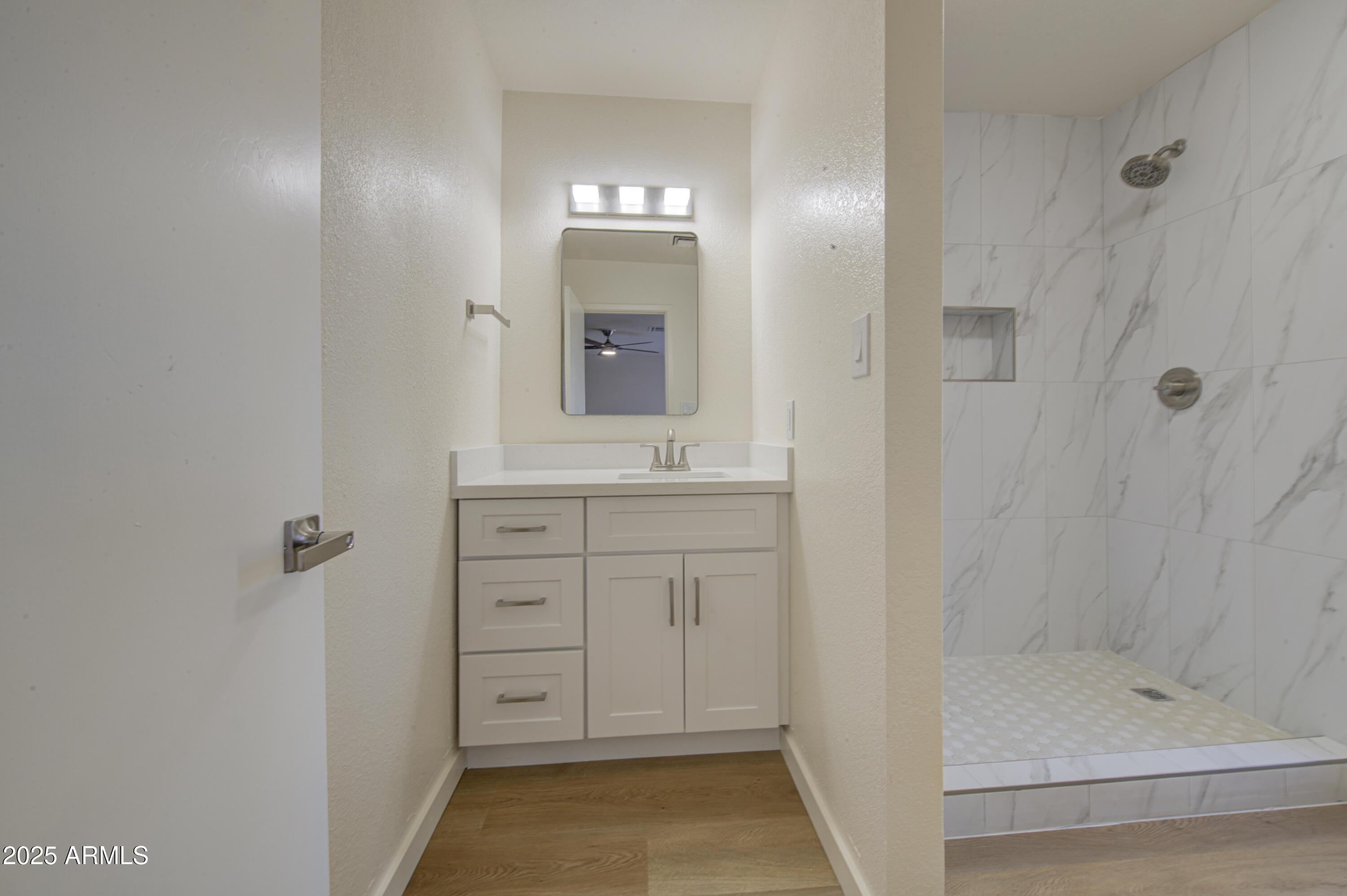 25450 West Clayton Road Casa Grande, AZ 85193 - Photo 28 of 80 a bathroom with a granite countertop sink a mirror and shower