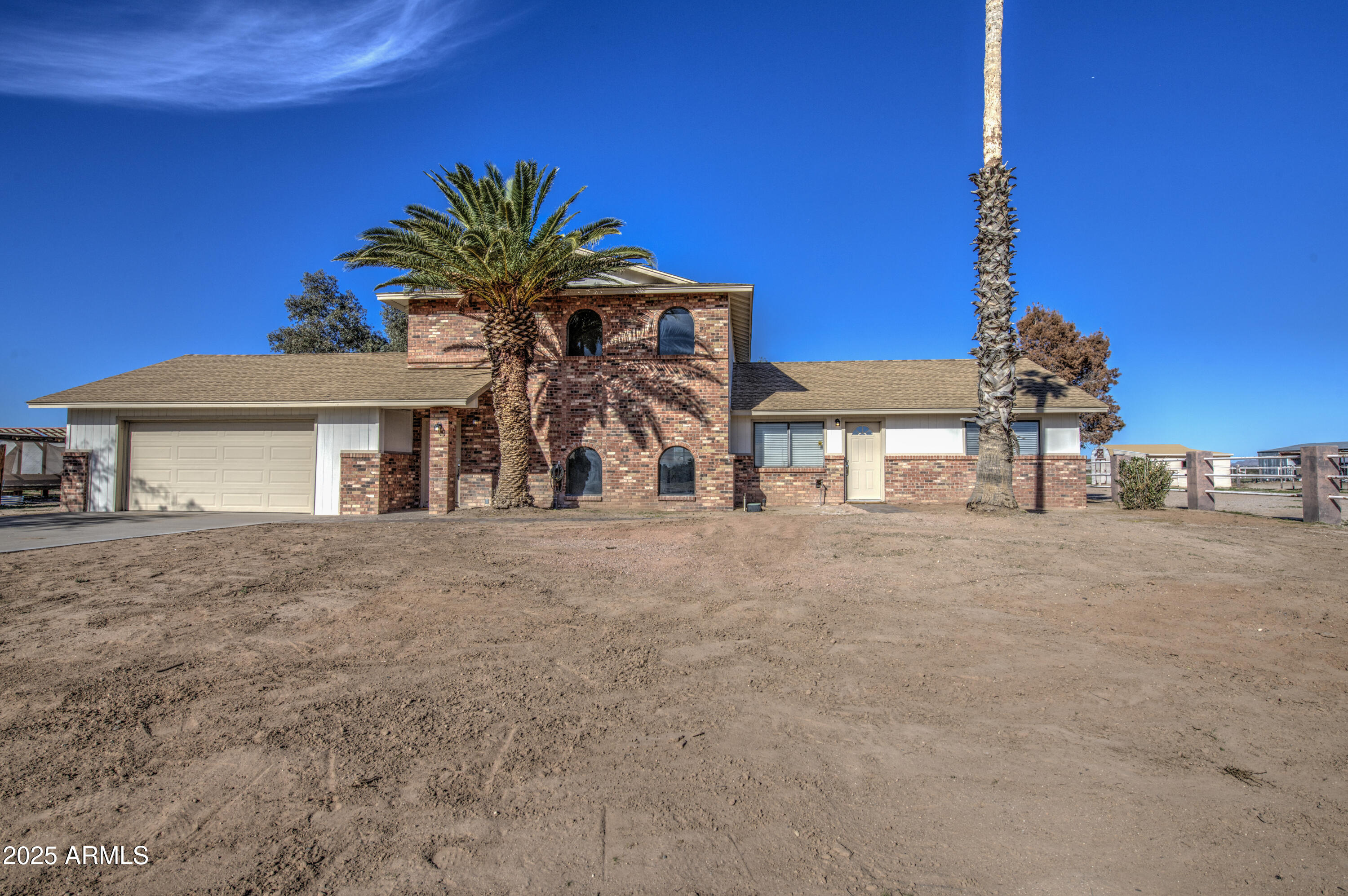 25450 West Clayton Road Casa Grande, AZ 85193 - Photo 3 of 80 a view of a house with a yard and garage