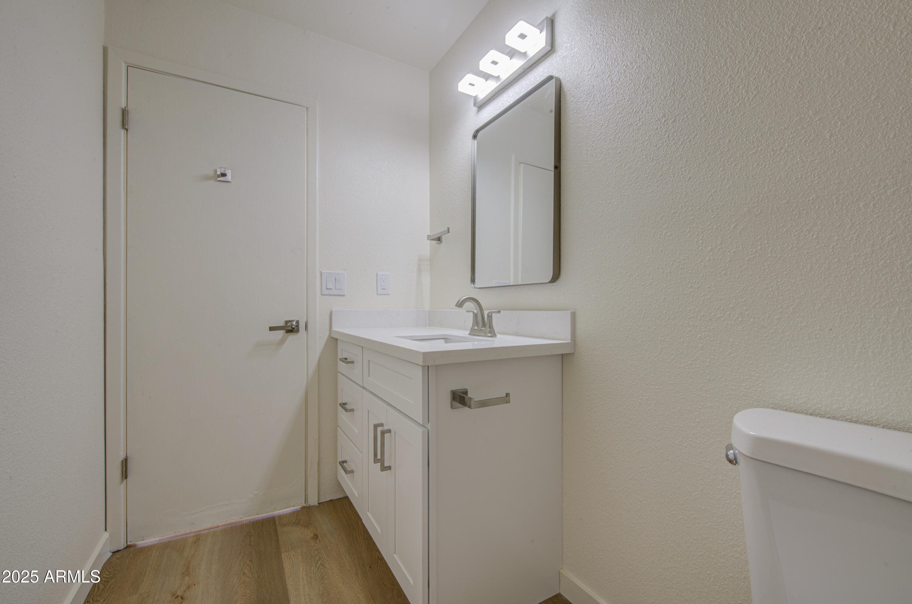 25450 West Clayton Road Casa Grande, AZ 85193 - Photo 39 of 80 a bathroom with a sink mirror vanity and toilet