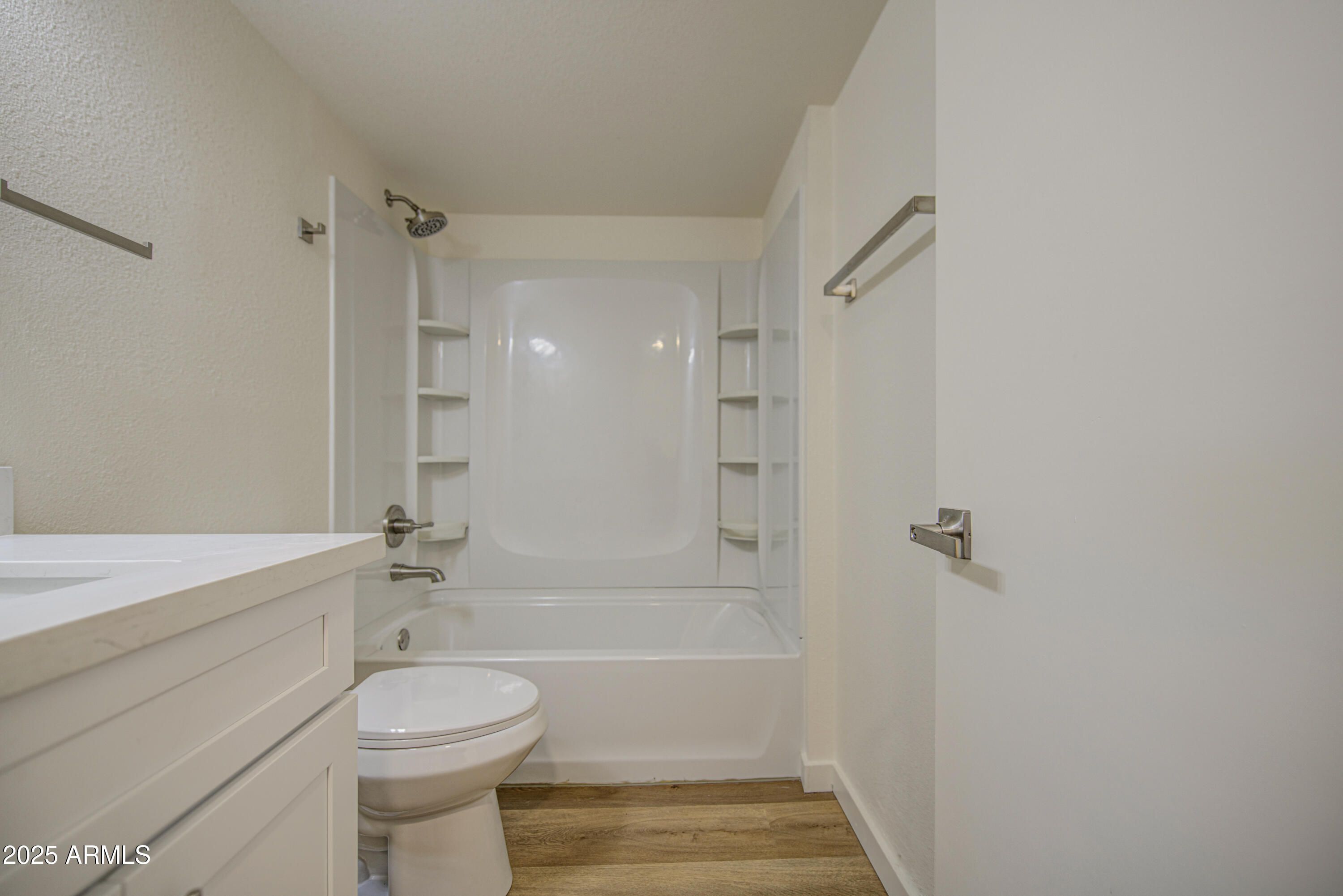 25450 West Clayton Road Casa Grande, AZ 85193 - Photo 40 of 80 a bathroom with a toilet a sink and bathtub