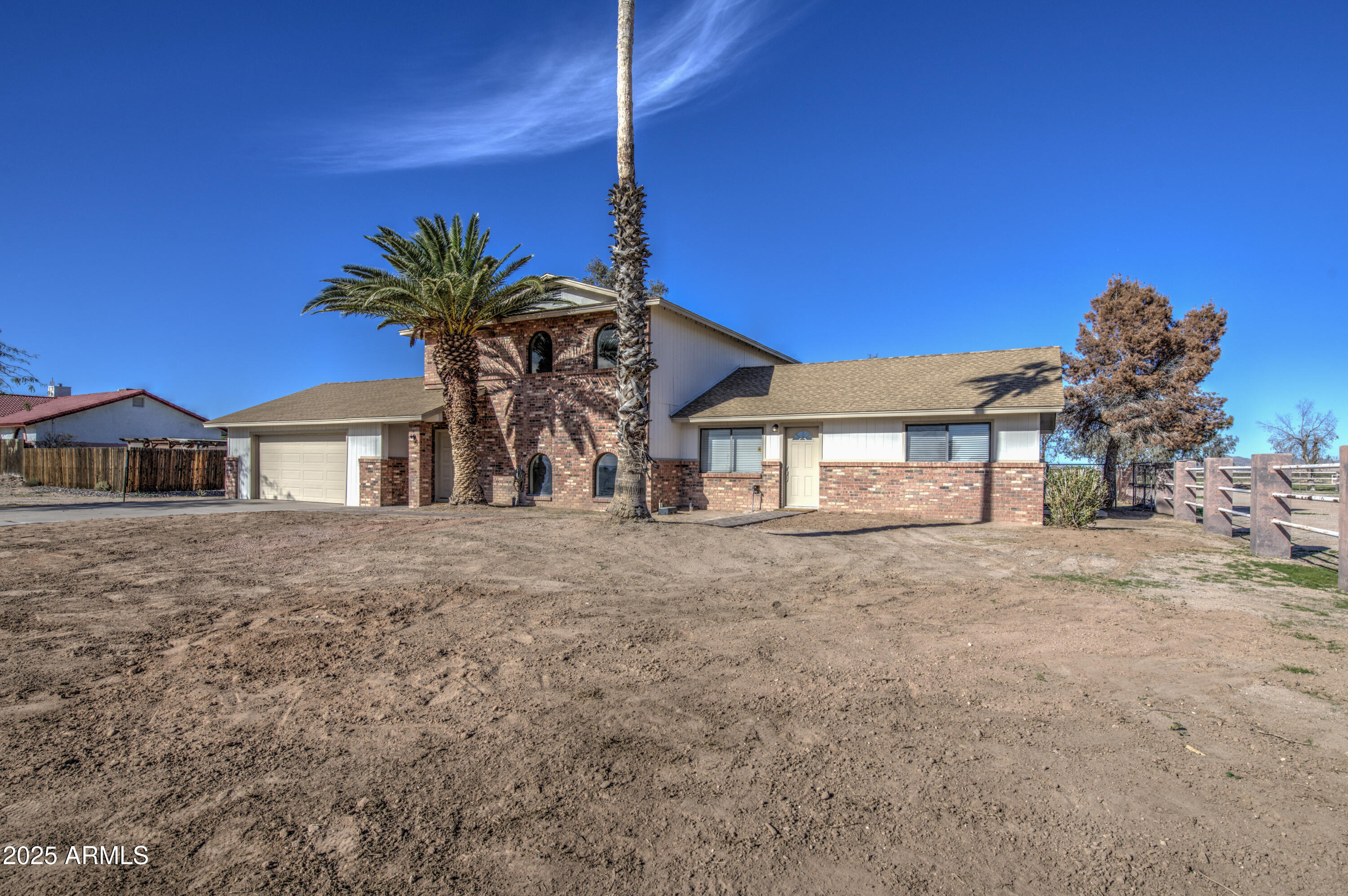 25450 West Clayton Road Casa Grande, AZ 85193 - Photo 4 of 80 a front view of a house with a yard and garage
