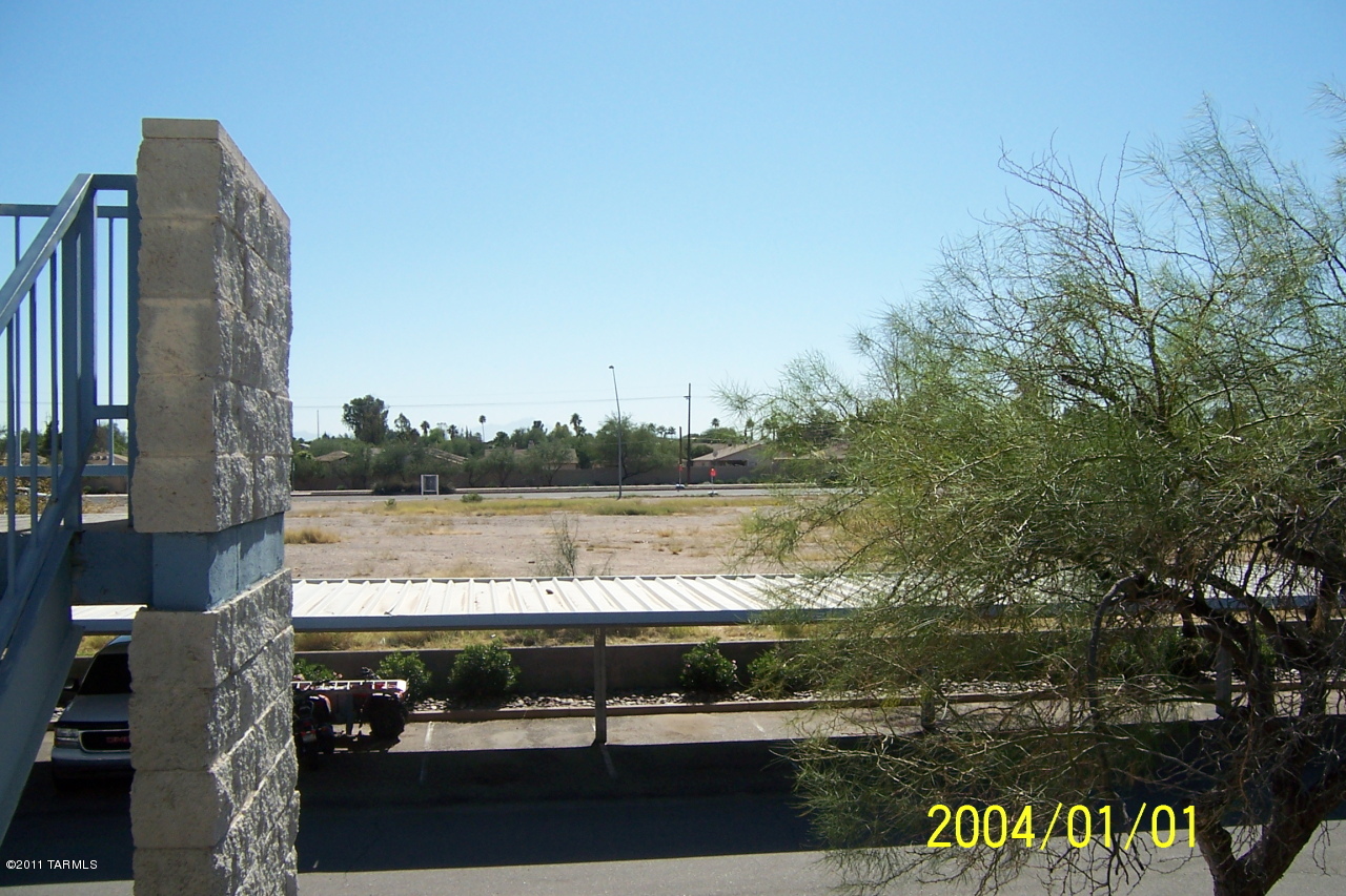 7777 East Golf Links Road, Unit 2205 Tucson, AZ 85730 - Photo 21 of 22 a view of lake with a yard