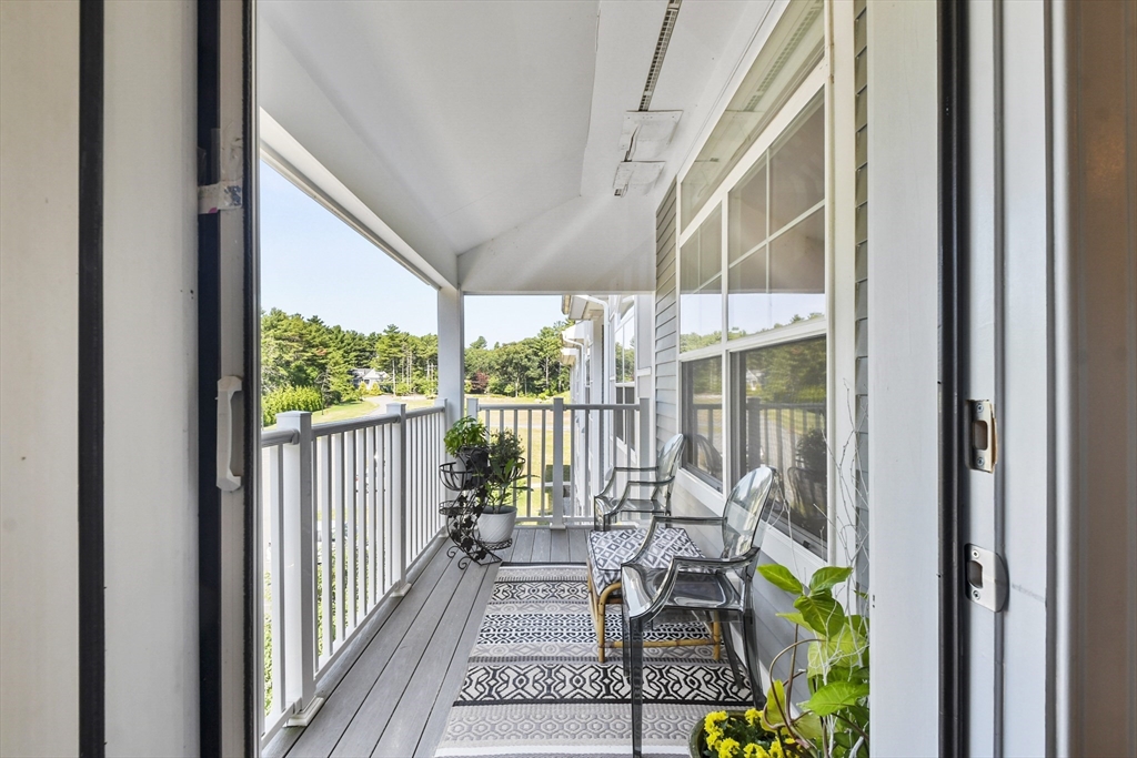 635 Old Post Road, Unit 303 Sharon, MA 02067 - Photo 16 of 33 a view of a balcony with furniture