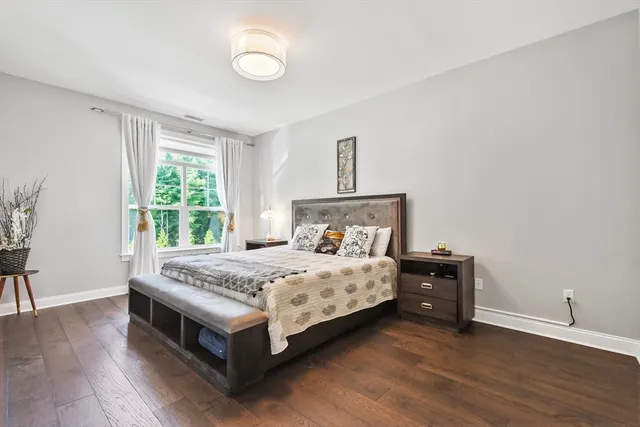 a bedroom with a bed and a table