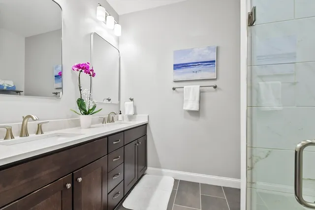 a bathroom with a sink vanity and mirror