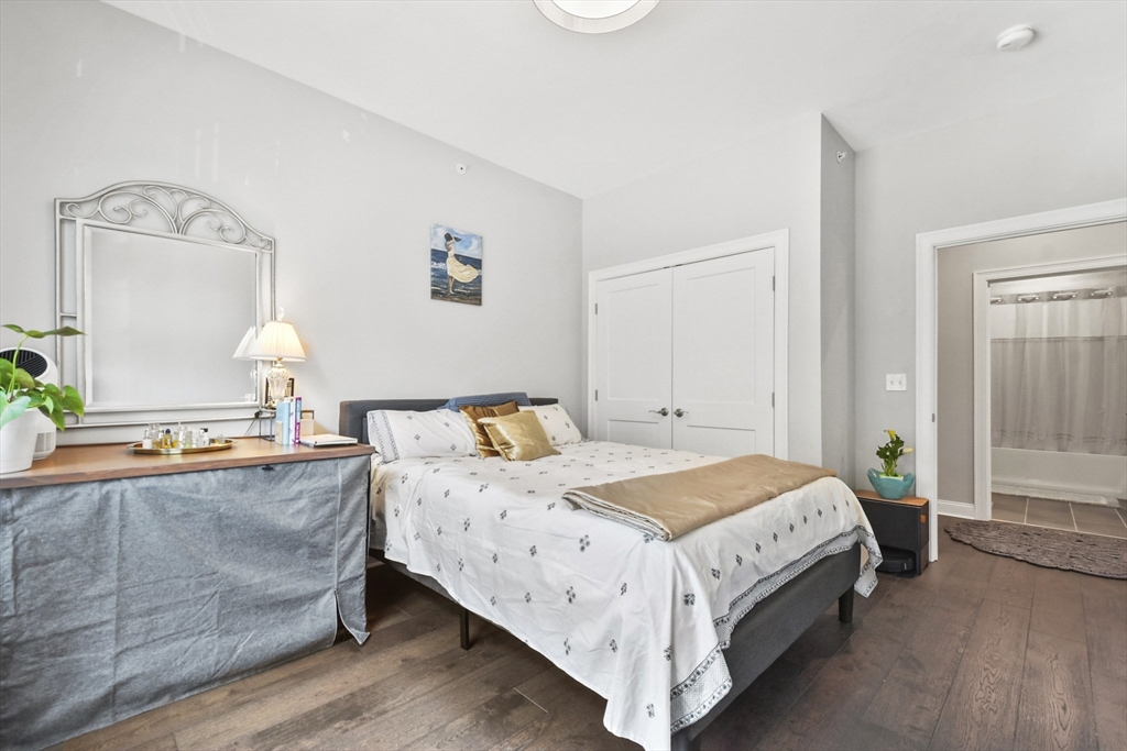 635 Old Post Road, Unit 303 Sharon, MA 02067 - Photo 23 of 33 a bedroom with a bed and window