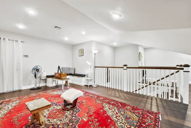 a bed room with furniture and a rug