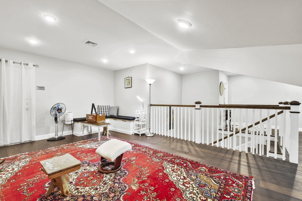 635 Old Post Road, Unit 303 Sharon, MA 02067 - Photo 30 of 33 a bed room with furniture and a rug