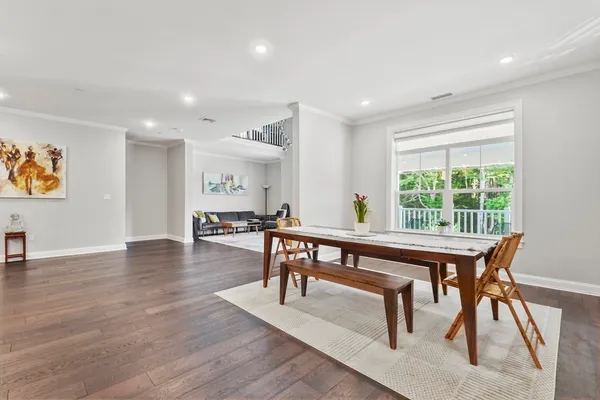 a view of a dining room with furniture window and wooden floor
