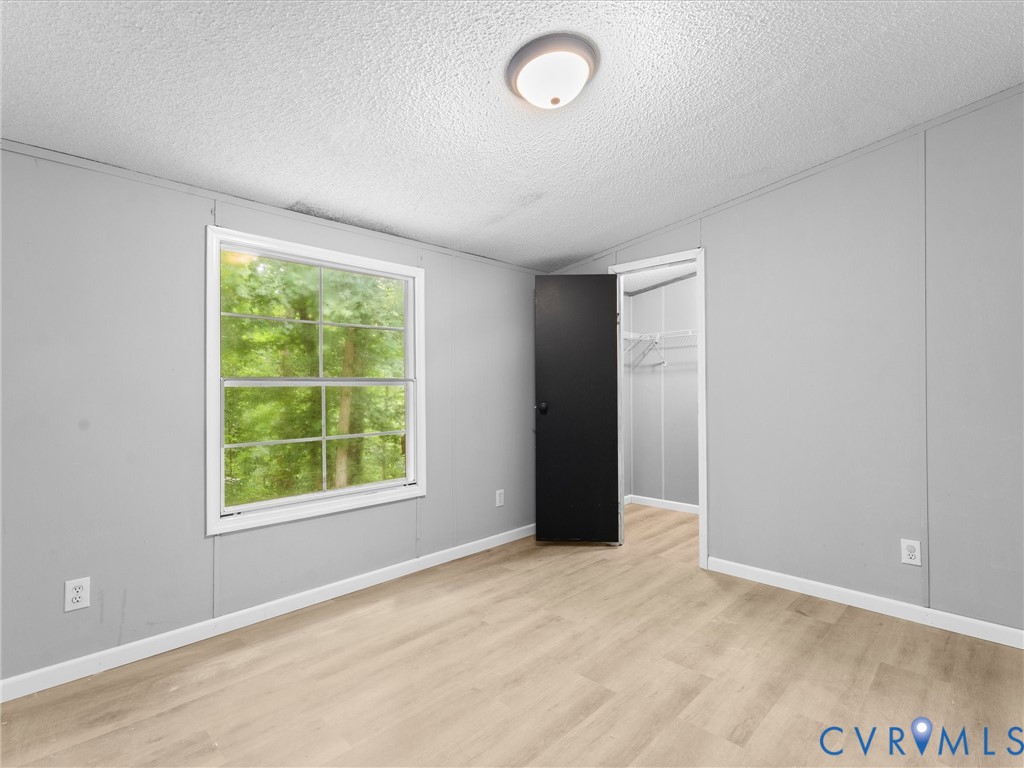 1909 Neves Road Beaverdam, VA 23015 - Photo 33 of 48 Light-toned wood-finish flooring complements the n