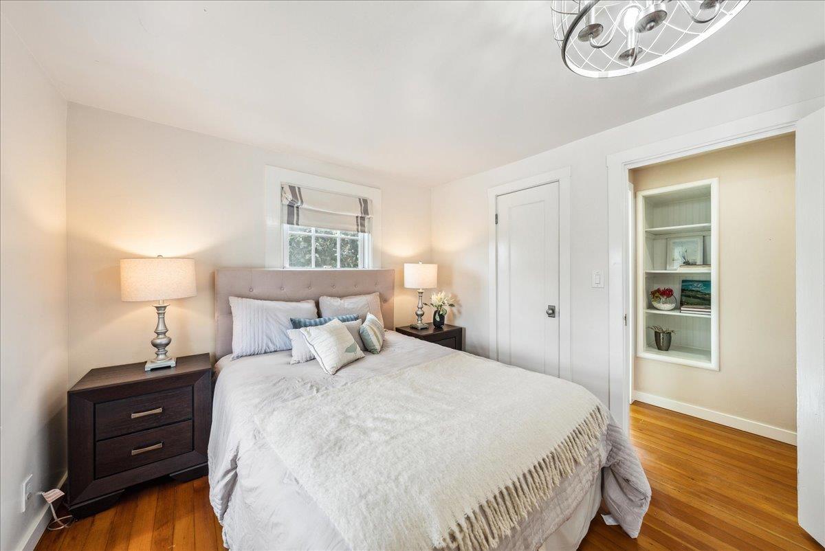 799 Grace Street Monterey, CA 93940 - Photo 13 of 38 a bedroom with a bed and a night stand