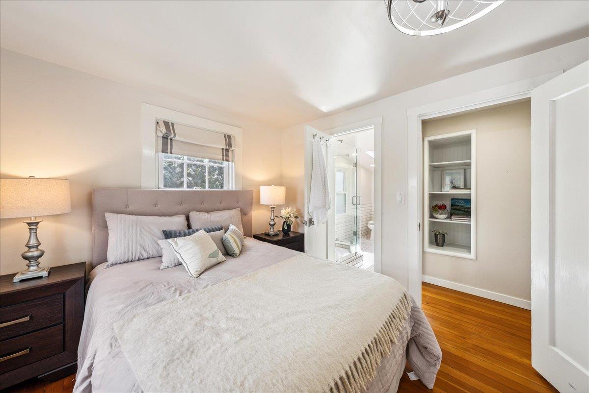 799 Grace Street Monterey, CA 93940 - Photo 14 of 38 a bedroom with a bed and wooden floor