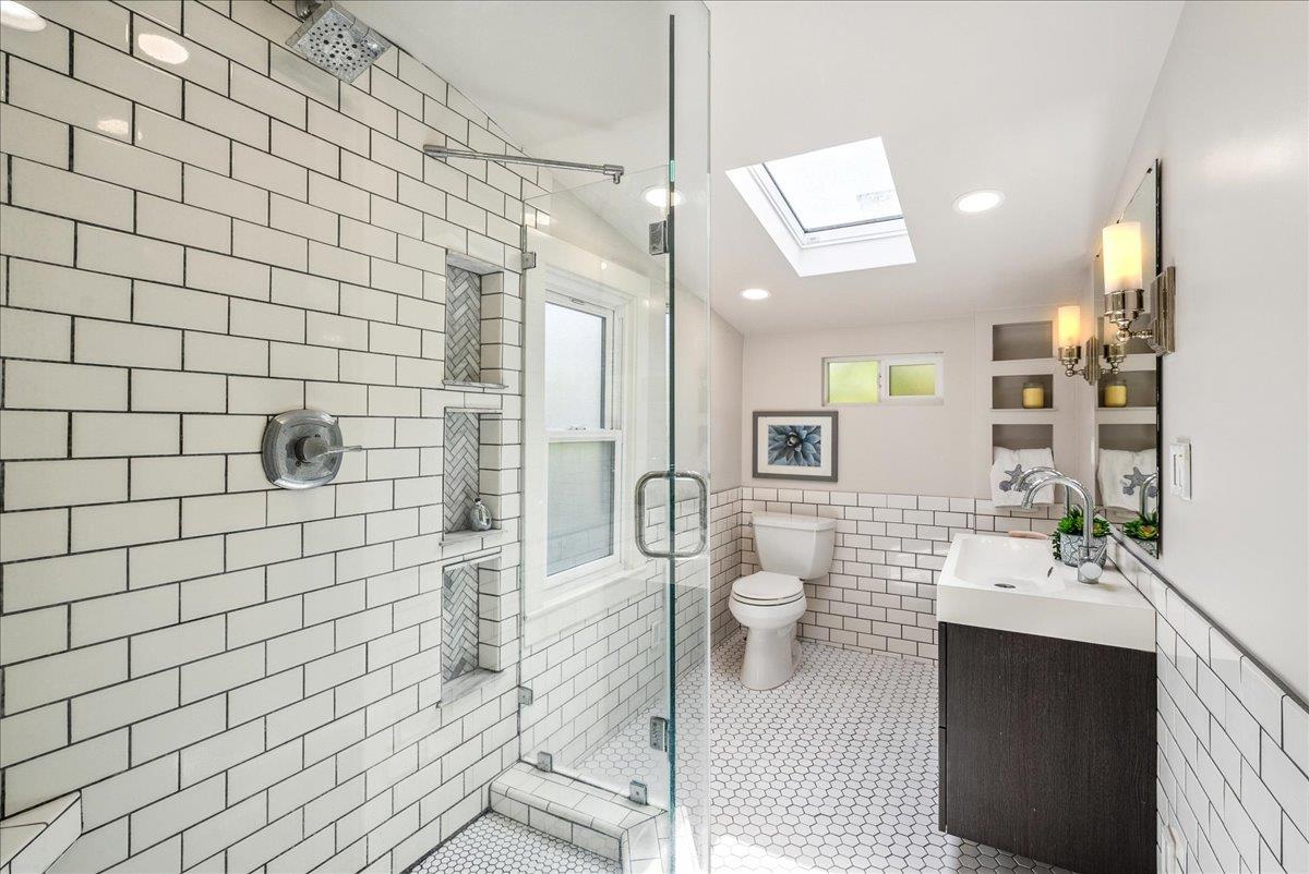 799 Grace Street Monterey, CA 93940 - Photo 15 of 38 a bathroom with a sink mirror and shower