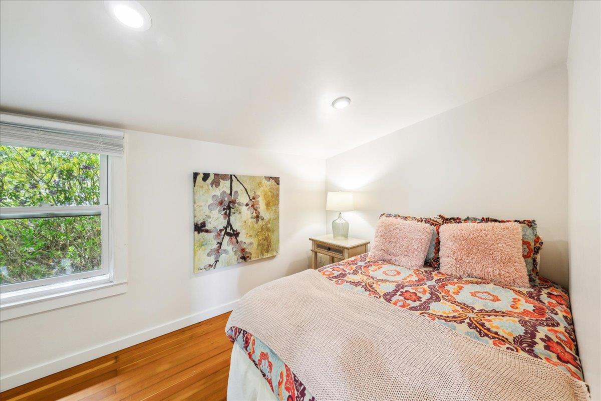 799 Grace Street Monterey, CA 93940 - Photo 17 of 38 a bedroom with a large bed and a window