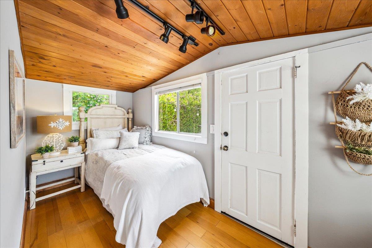 799 Grace Street Monterey, CA 93940 - Photo 18 of 38 a bedroom with a bed and a window