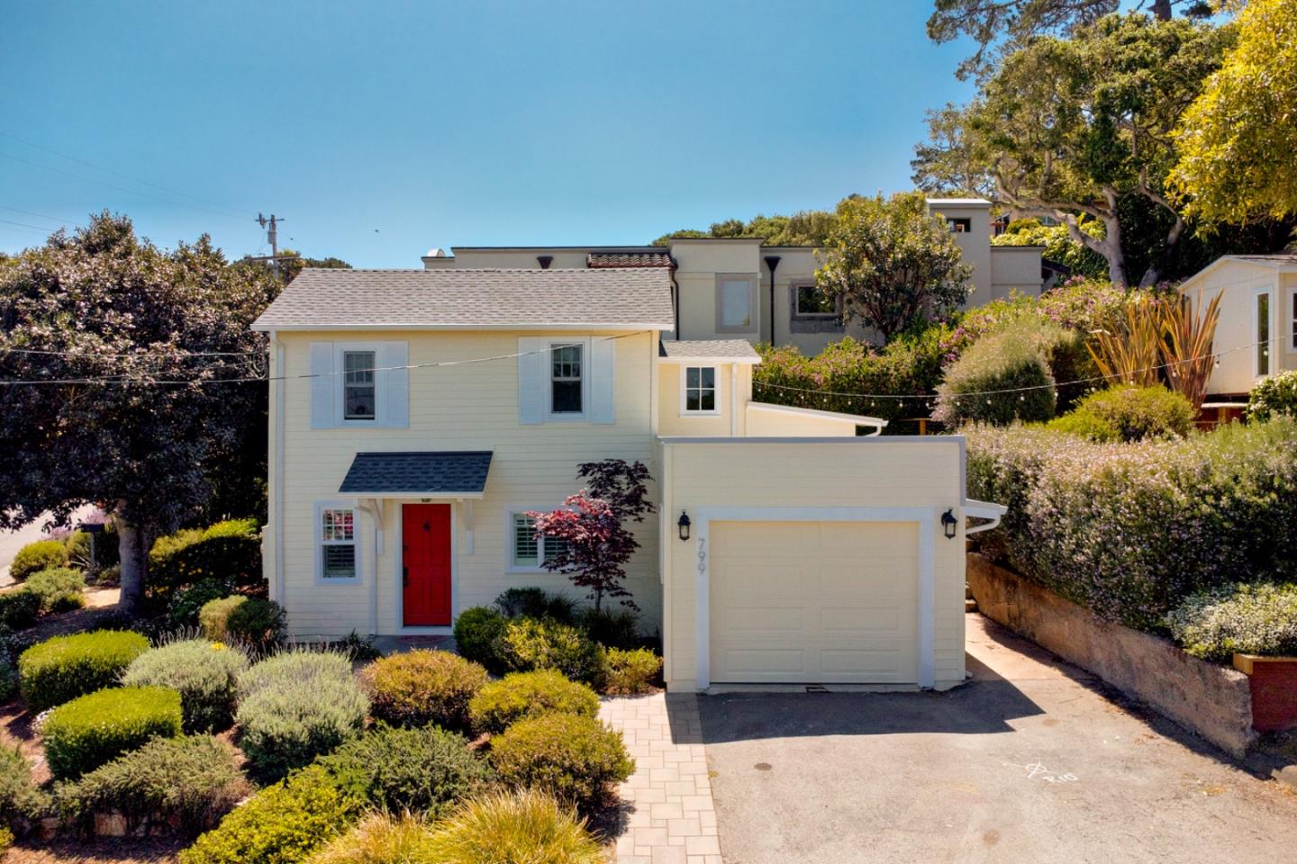 799 Grace Street Monterey, CA 93940 - Photo 27 of 38 a view of a house with a yard and a garage