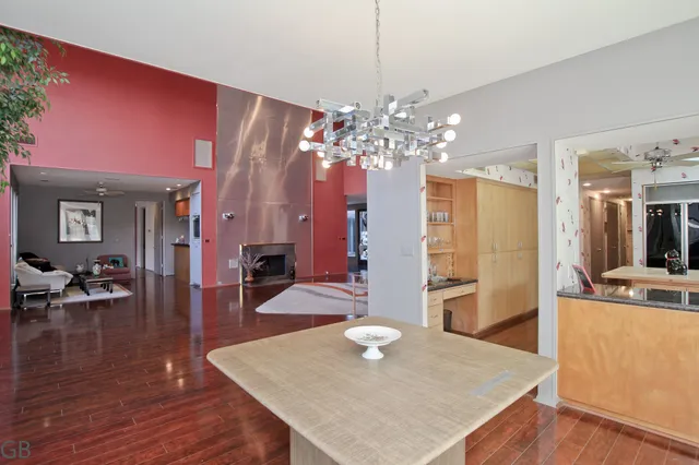 a kitchen with a sink cabinets and wooden floor