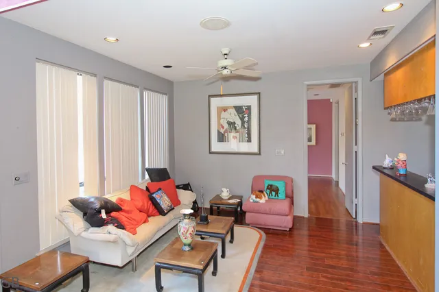 a dining room with furniture and wooden floor