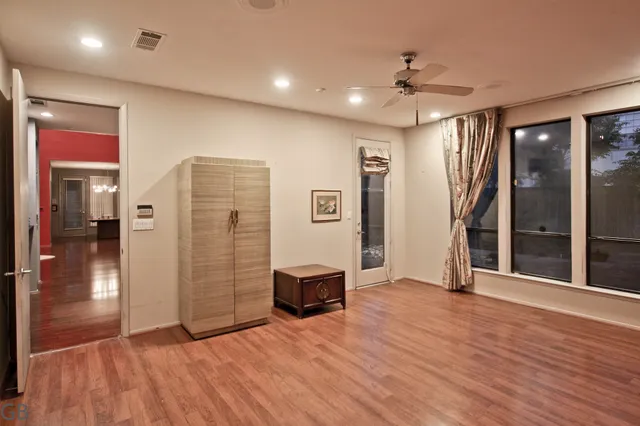 a kitchen with stainless steel appliances granite countertop a stove and a wooden floors