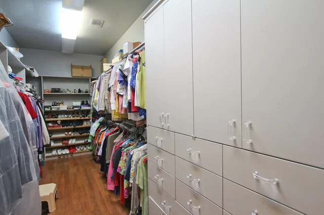 a large bathroom with a double vanity sink and a large mirror