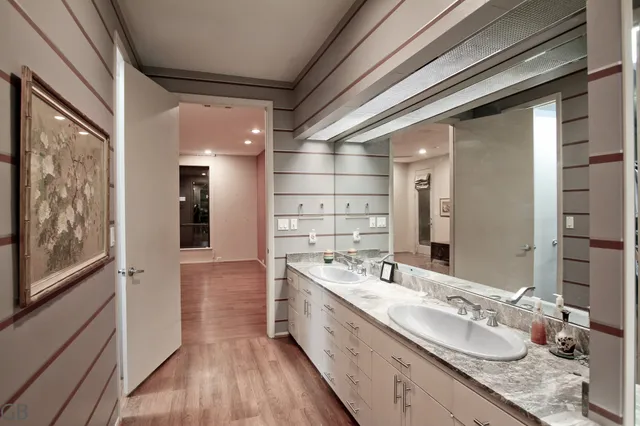 a large kitchen with granite countertop a large window and stainless steel appliances