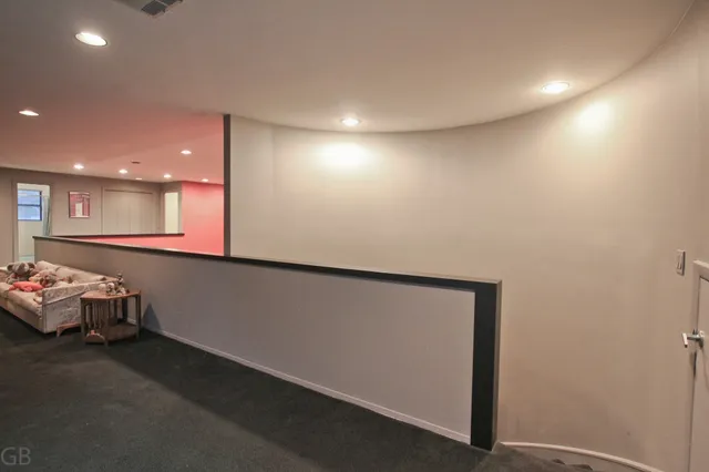 a bed room with a bed and a ceiling fan