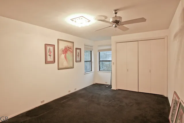 a view of a hallway with a bathroom