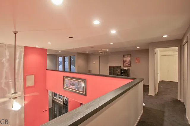 a view of a big room with closet and windows