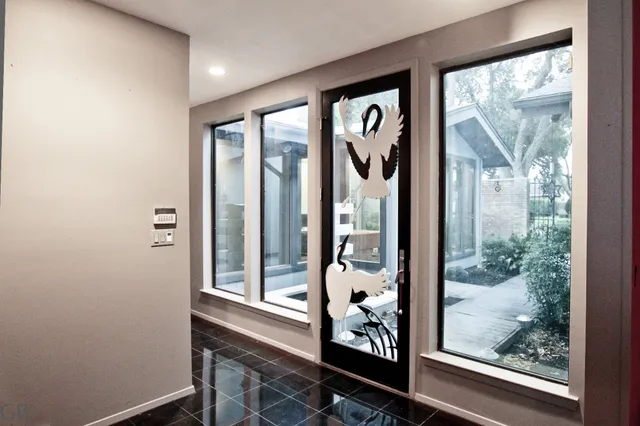 hallway with wooden floor and a floor to ceiling window