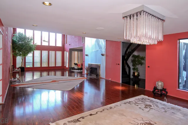a view of a living room and chandelier