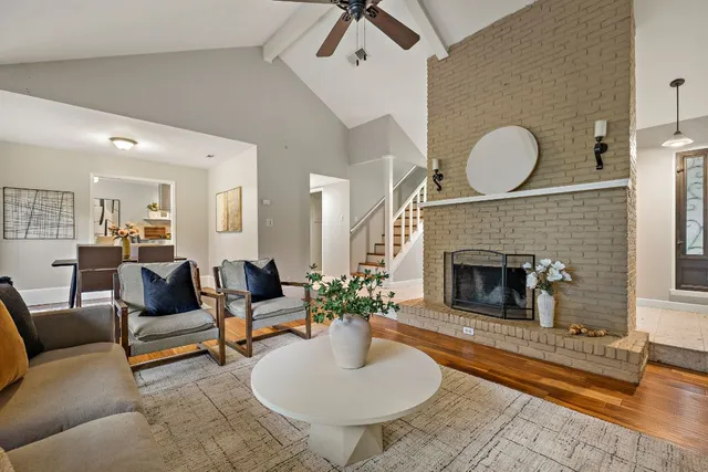 a living room with furniture and a fireplace